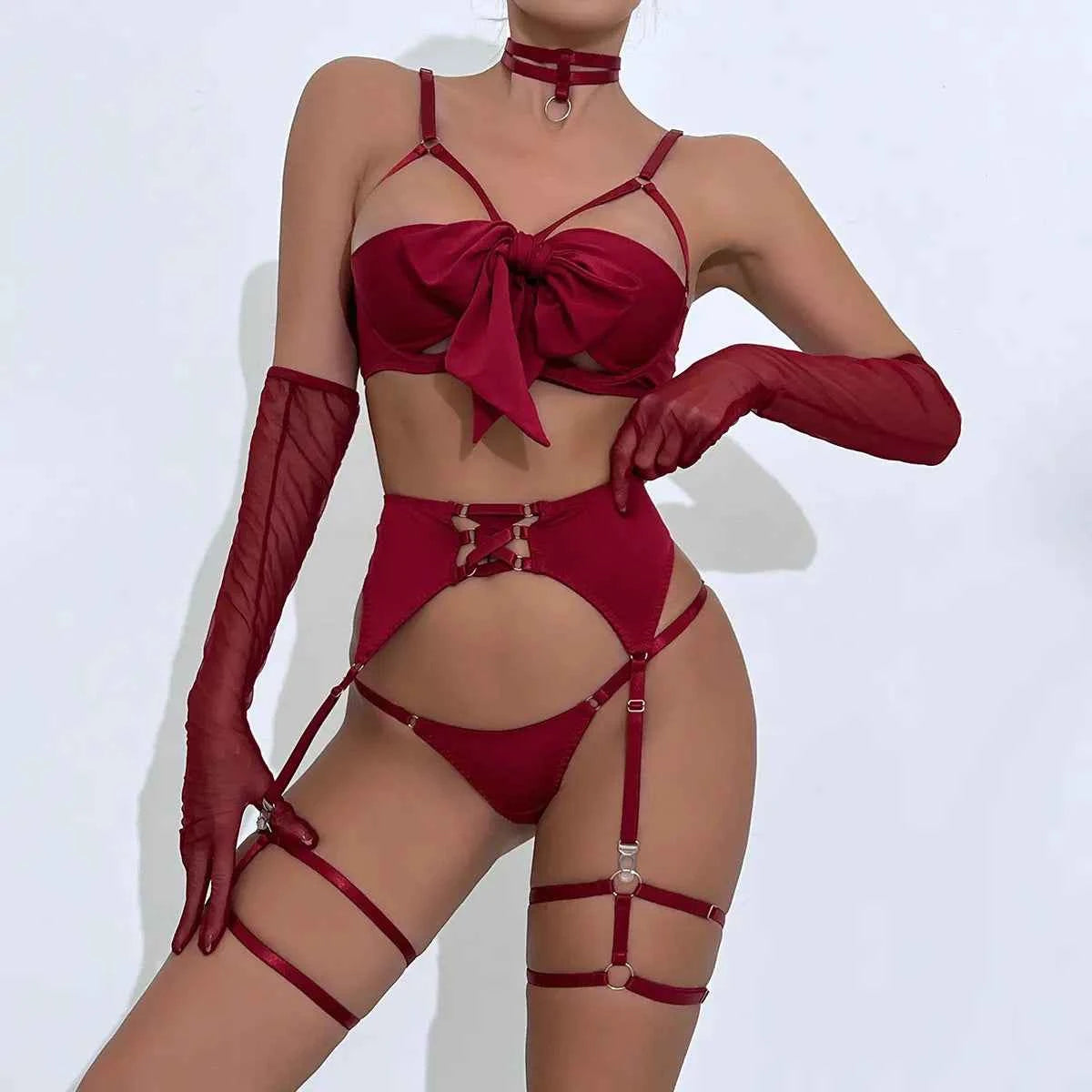 Red lingerie set with matching gloves on a white background