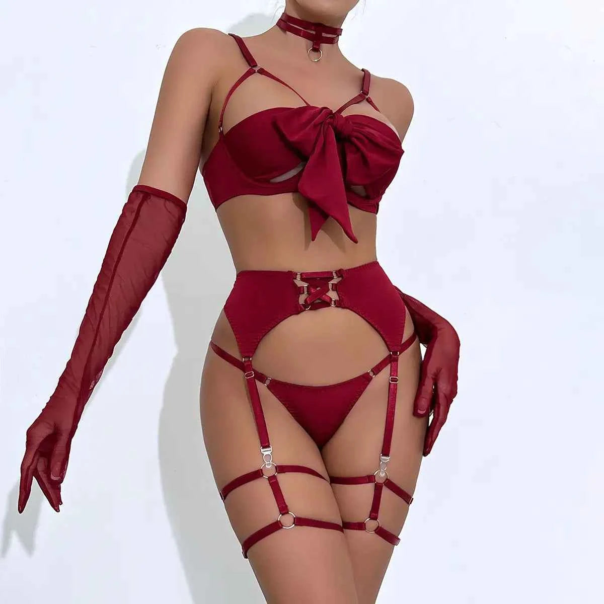 Red lingerie set with matching gloves on a white background